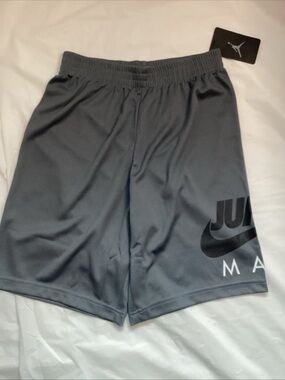 Nike Gray Athletic Shorts with Black Swoosh